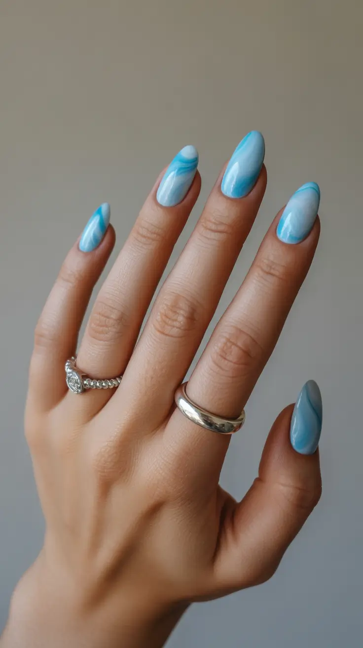 spring nail colors 2026 Sky Blue Watercolor Swirl
