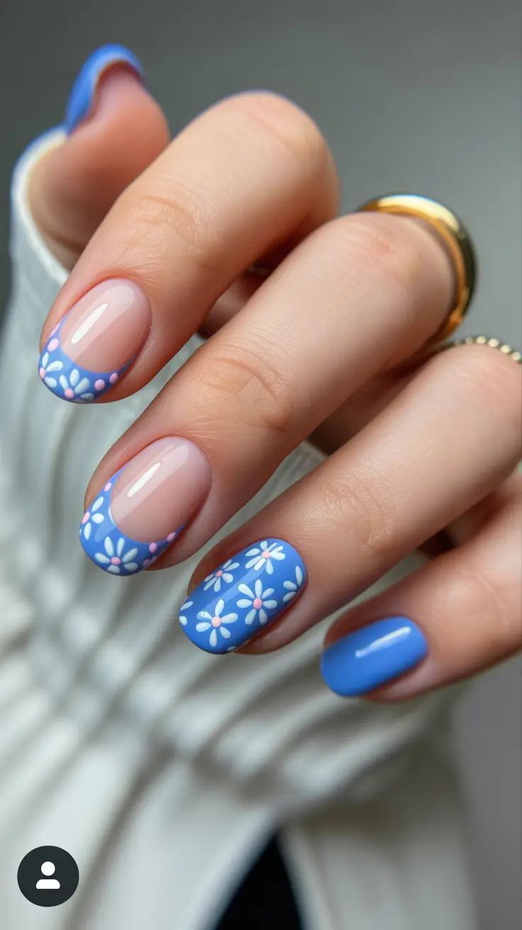 elegant cute spring nails 2026 Blue Floral French Tips on Short Oval Nails