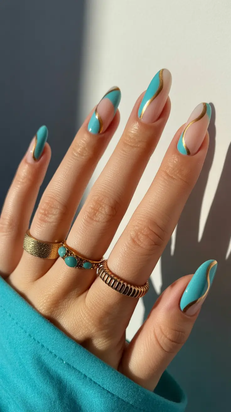 fun spring nails 2026 Turquoise waves with gold contour lines