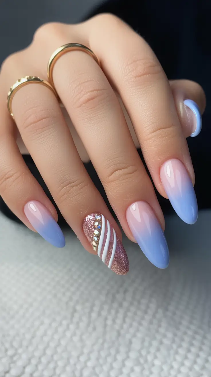 spring almond nails 2026 Soft Blue Ombre Almond Nails with Glitter Accent