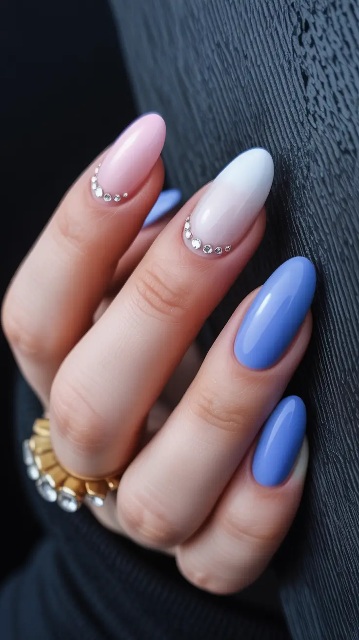 amazing spring almond nails 2026 Blue Gradient Almond Nails with Minimal Rhinestone Detail