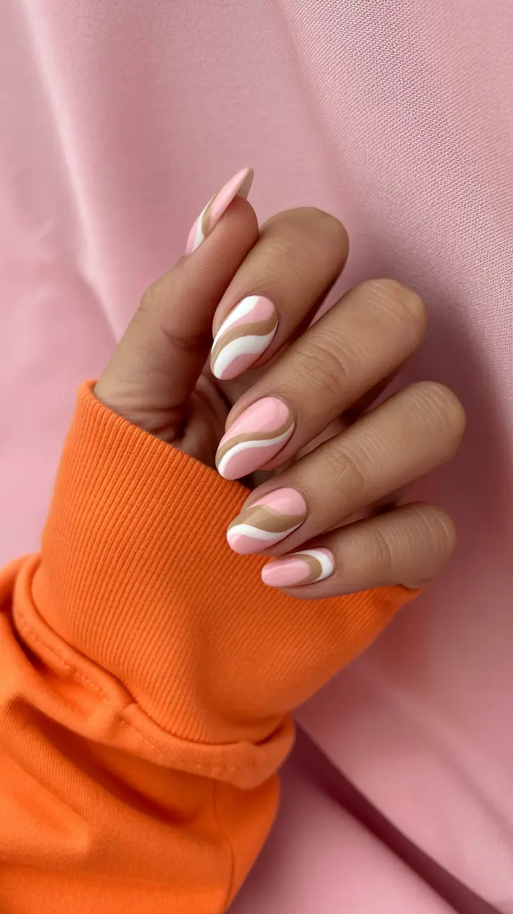 chic spring pastel nails for 2026 soft blush swirl manicure
