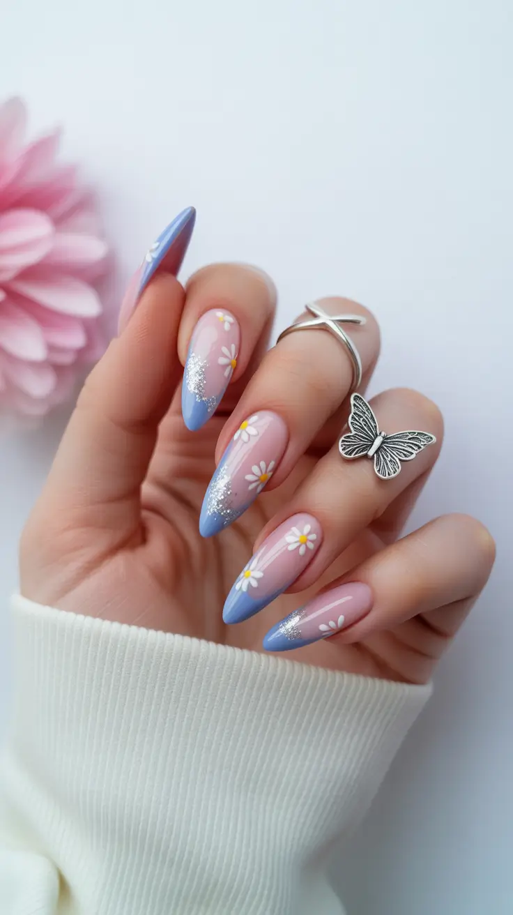 chic spring pastel nails for 2026 blue french tip daisy manicure