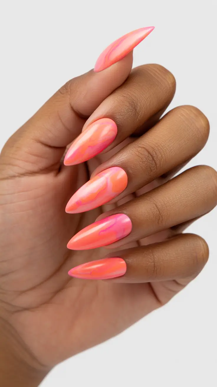 bright spring nails 2026 Coral Marble Almond Nails That Capture Spring Heat