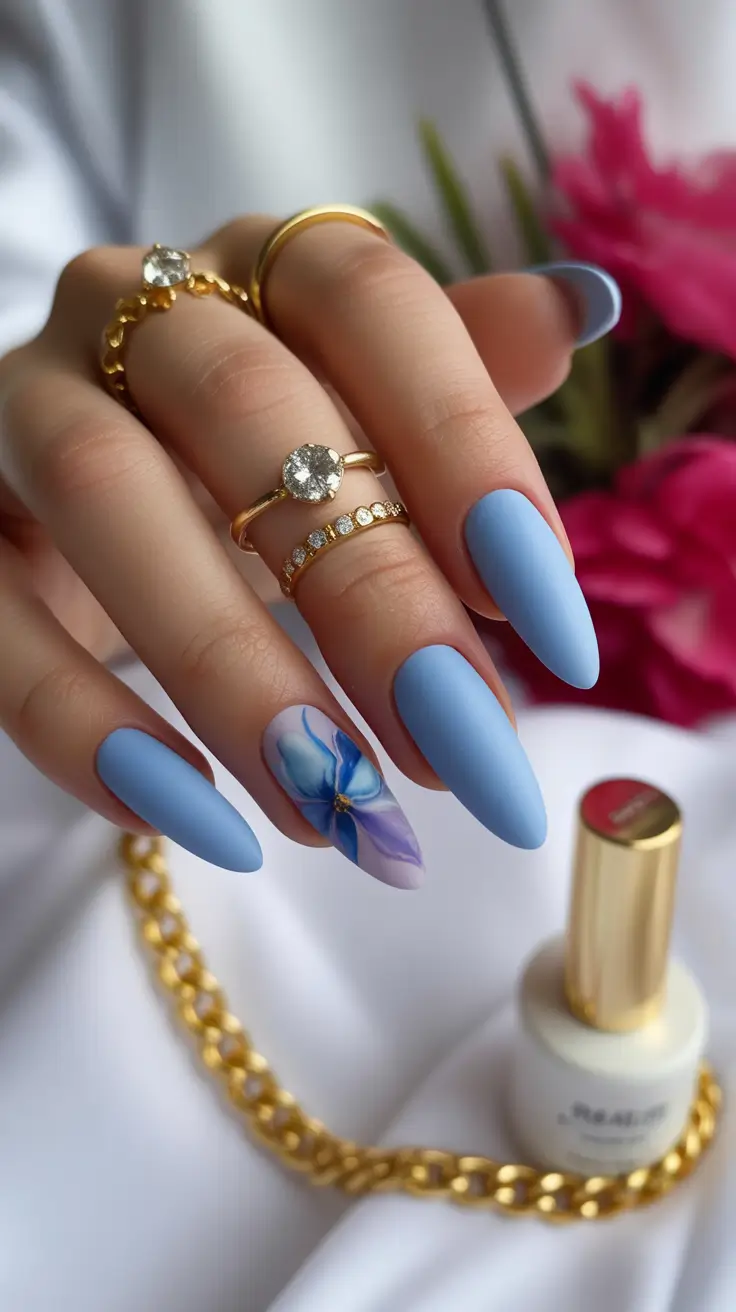 new early spring nails 2026 Soft Sky Blue Matte Nails with Floral Accent Art