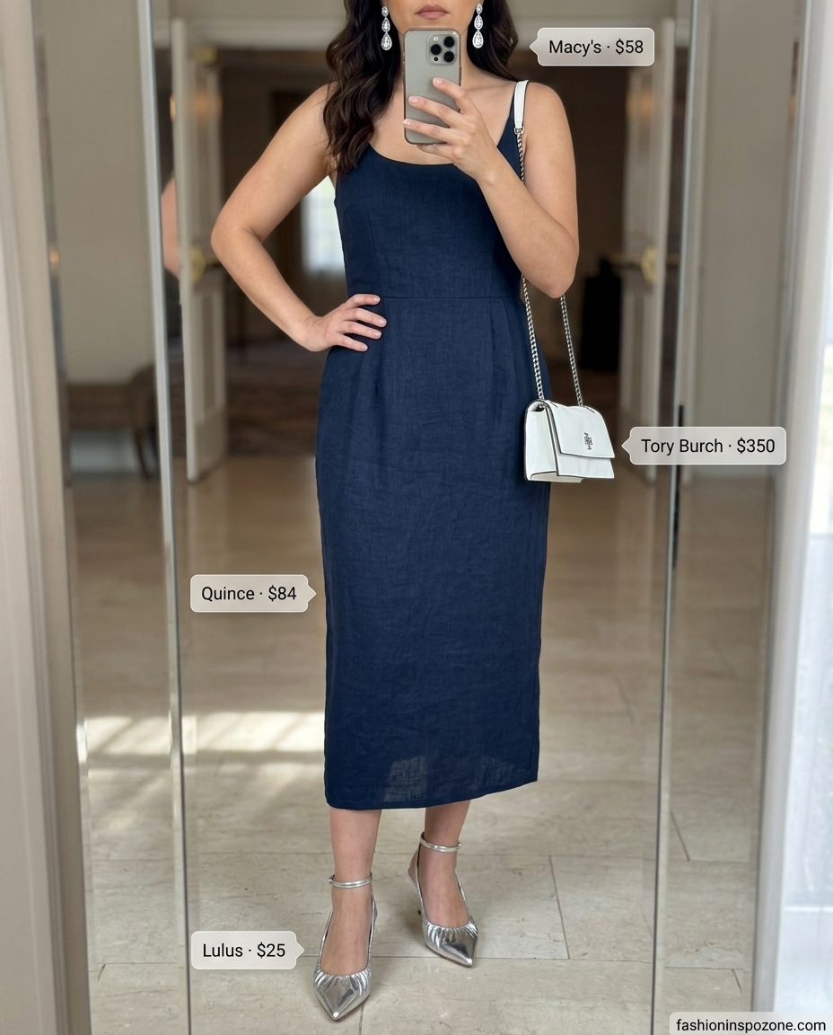 Modern navy blue jumpsuit for summer garden wedding guest outfits for women 2026. Sleek cocktail party look with silver heels.