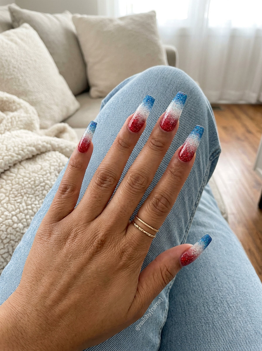 Glamorous 4th of July nails 2026: Extra-long coffin nails with red, white, and blue glitter gradient.