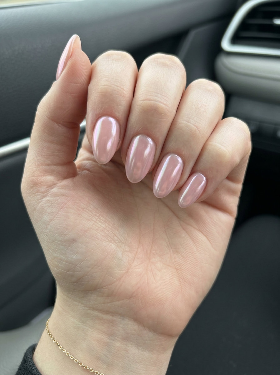 Sheer glazed pink almond nails 2026 for fair skin. Ethereal, luminous vacation-ready manicure with pearlescent shimmer.