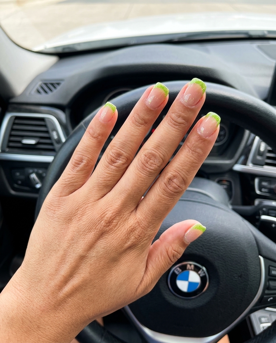 Fun summer nails 2026: Electric lime green glitter French tips for summer events and parties.