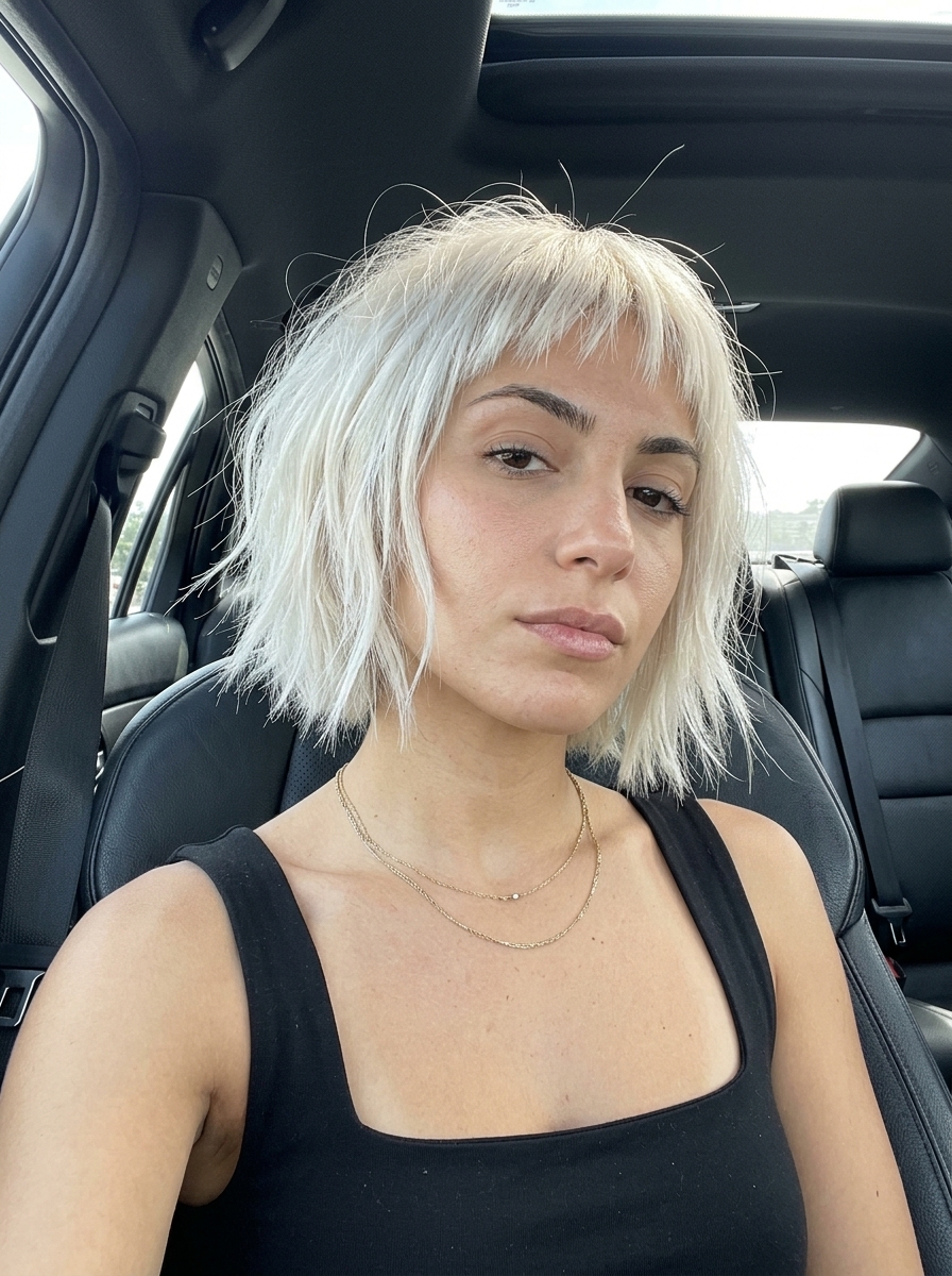 Arctic Freeze Choppy Bob 2026 chin-length choppy bob haircut with icy arctic blonde, razor-cut texture & micro-fringe for high-fashion events