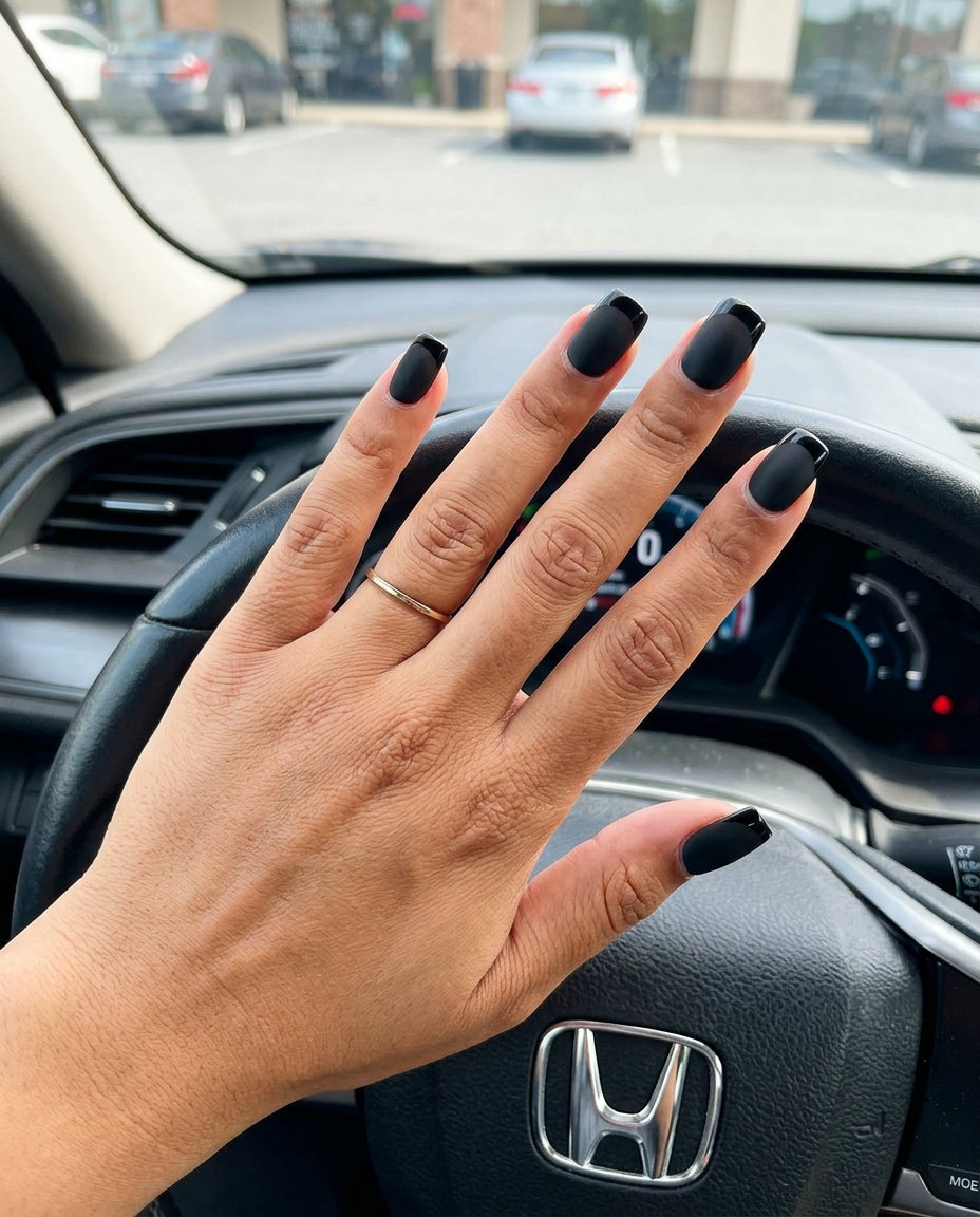 Matte Onyx French nails for night outs, an edgy and sophisticated summer trend 2026.