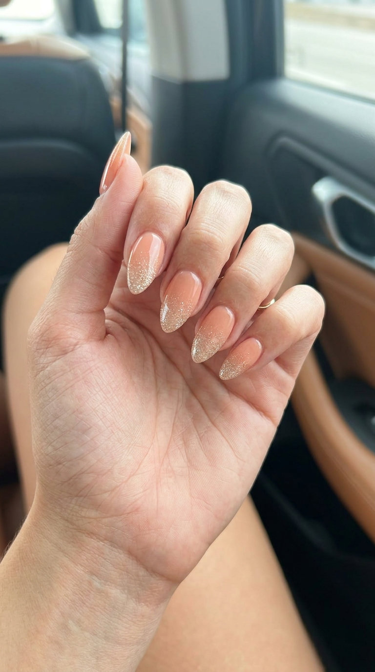 Sparkling peach ombre almond nails with champagne glitter for weddings. June nails ideas - summer ideas 2026.