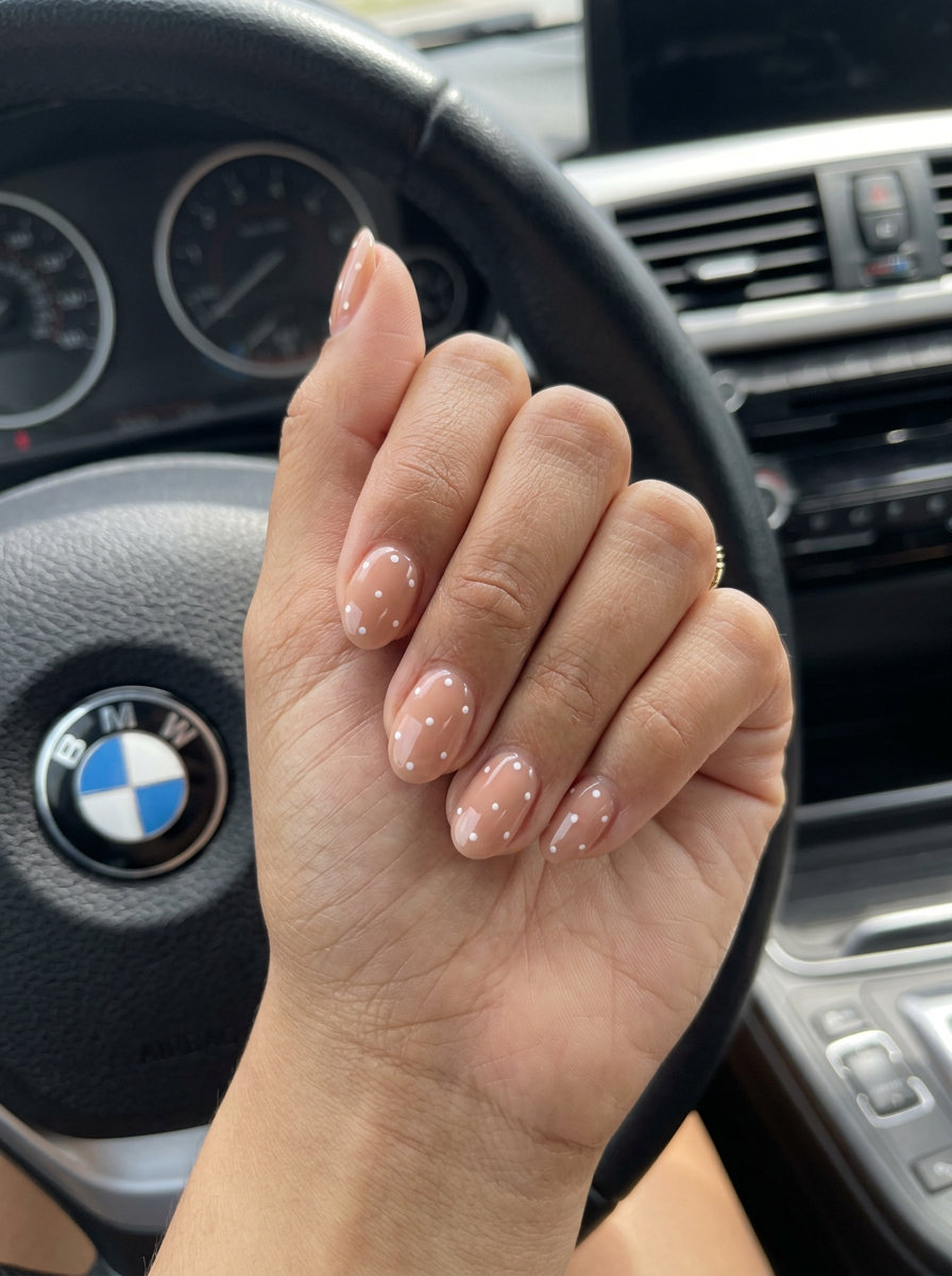 Minimalist white dots on warm nude short oval summer nails 2026 for daily wear.