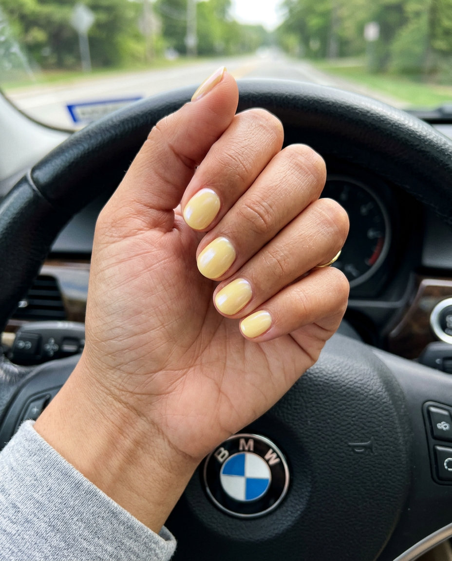 Butter Yellow Pearlescent Sheen short round summer nails 2026. Whimsical, bright style for casual wear & picnics.