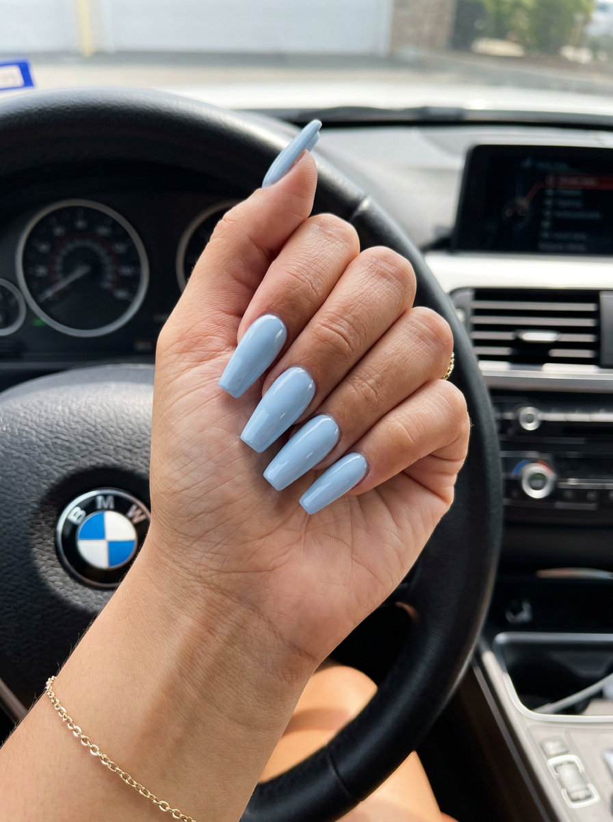 Pastel Sky Soft Coffin nails: simple summer acrylic nail designs 2026. Opaque baby blue, high-gloss finish, elegant for vacation.