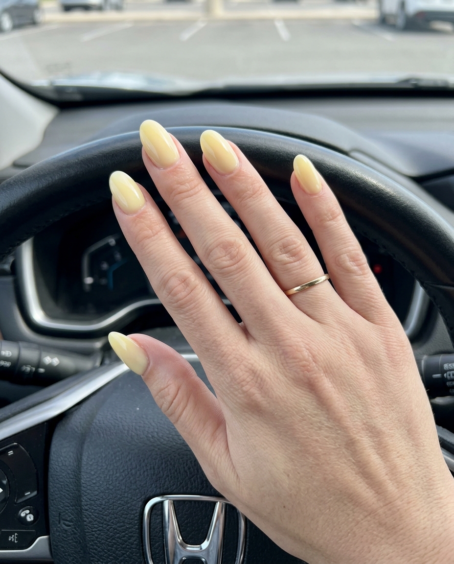 Milky butter yellow oval nails for solid summer nails 2026. Romantic, gentle, and clean brunch style.