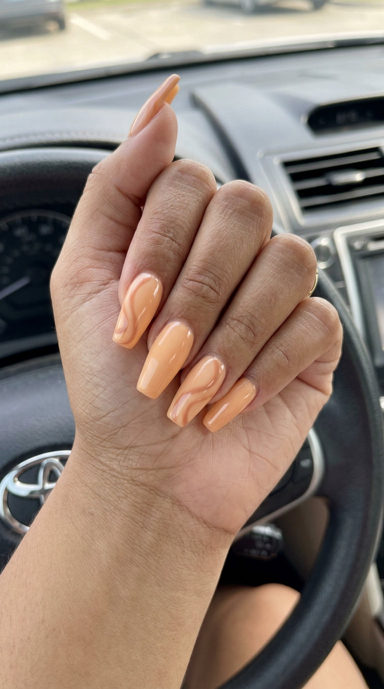 Peachy Milky Swirls nails: warm milky peach with tan swirls for summer classy nails 2026. Bohemian vibe.