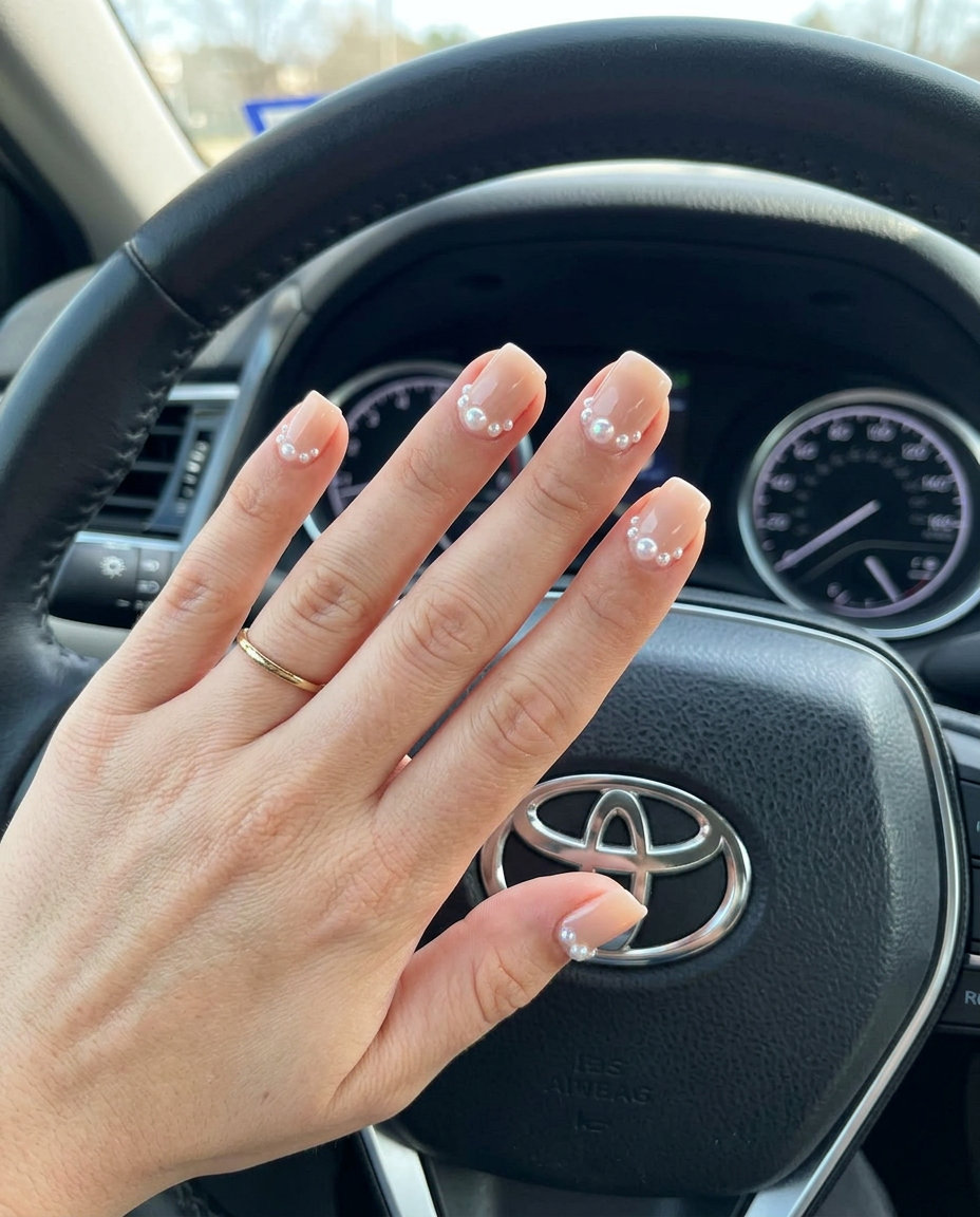 Pearl Dew Drop Nude nails: clean nude with iridescent pearls for summer classy nails 2026. Quiet luxury.