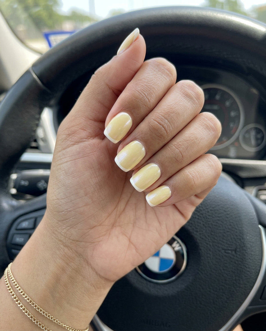 Butter Yellow French Tips 2026: Elegant & Romantic Elegant butter yellow pearlescent French tip nails for summer colorful nails designs 2026.