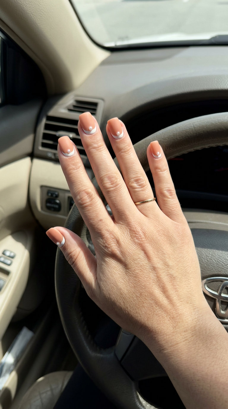 Sophisticated matte nude reverse French tip nails with pearl for summer 2026 work and weddings.