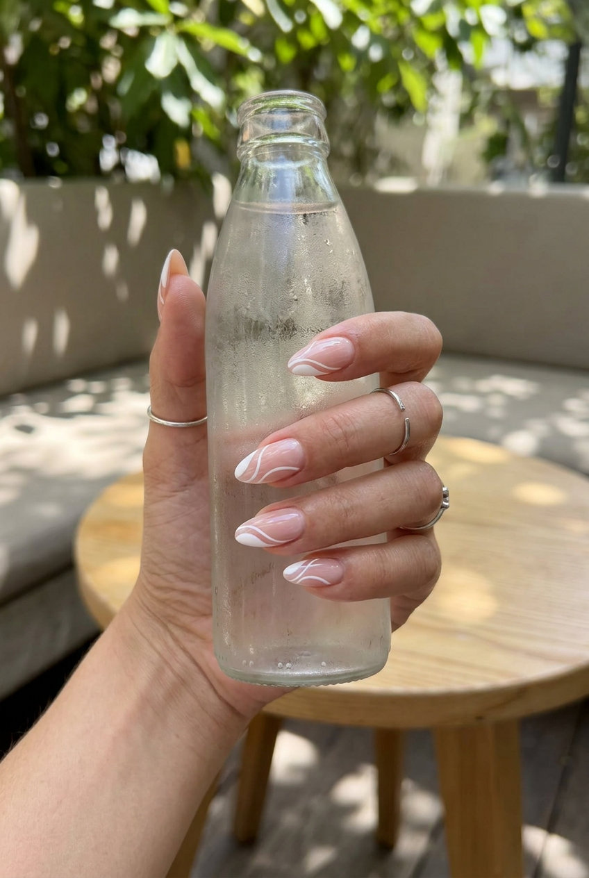 Chic white deconstructed French swirl nails for summer 2026 daily wear and office.