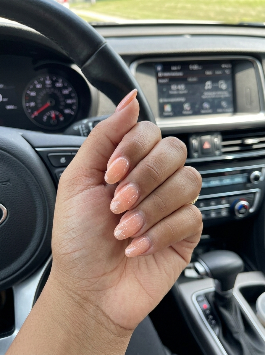Romantic soft peach fine glitter oval nails for summer glitter nails 2026, perfect for daily wear and casual looks.