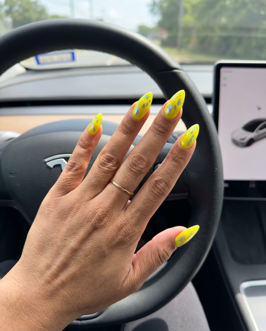 Futuristic lemon zest foil flakes squoval nails for festivals and parties. Summer nails yellow 2026.