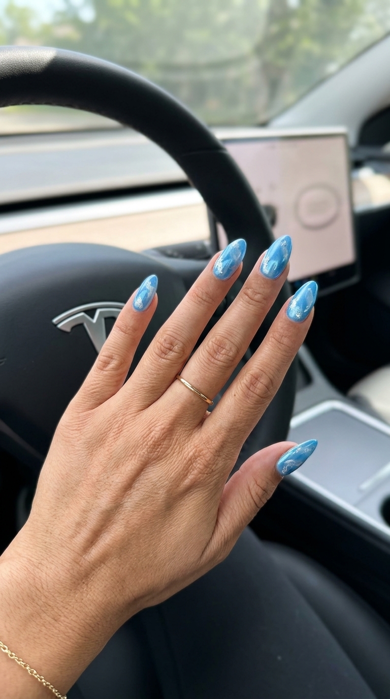 Sky Blue Milky Swirls nails for summer vibes nails 2026. Dreamy and artistic casual look.