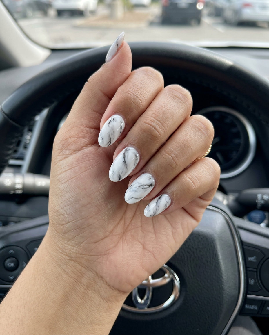 Marble swirl oval nails for formal events and business meetings, a sophisticated trending summer nails 2026 option.