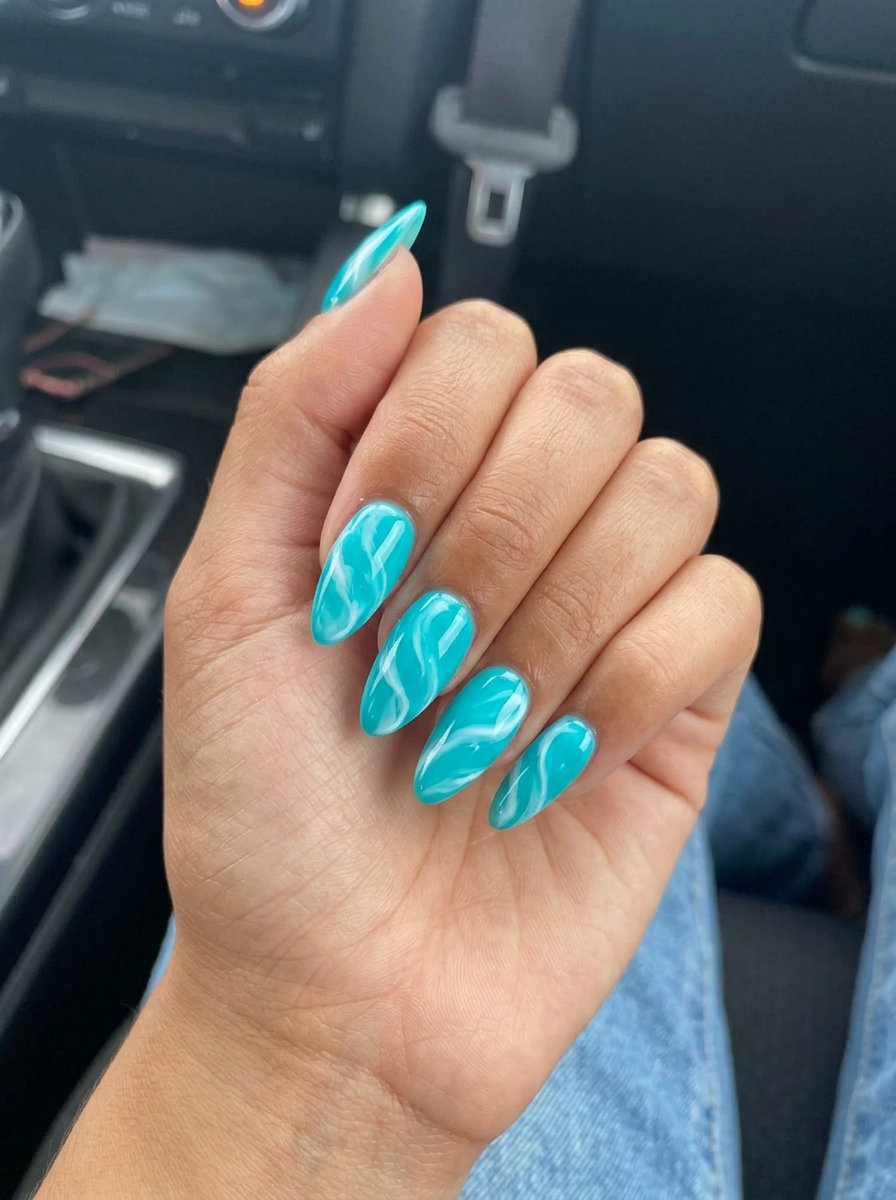 Turquoise Wave Swirls nail art 2026: Electric turquoise & opaque white abstract swirls for parties.